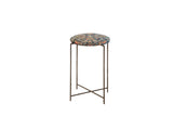 Antique rug fragment side table with a navy and saffron patterned top and slender metal legs.