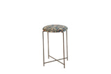 Reclaimed antique rug fragment side table with a navy and saffron patterned top and a vintage metal stand.