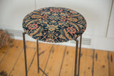 Cushioned antique Persian Fereghan rug fragment top showing intricate navy, coral, and cream motifs.