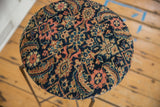 Cushioned antique Persian Fereghan fragment, intricate curvilinear navy, peach, gold pattern.
