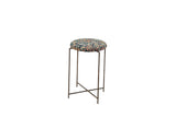 Reclaimed antique rug fragment side table with a patterned navy cushioned top and vintage metal stand.
