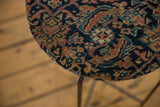 Textured, hand-knotted pile of the antique Persian rug top in navy, saffron, and indigo.