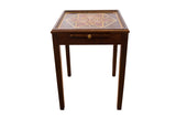Dark brown vintage square end table with gold, white, red dot pattern on top.