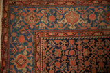 The Turtle Samovar interconnected vinery border on a vintage red and blue Malayer carpet.