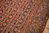 Blue Turtle Samovar border beside the red Herati patterned field of a vintage Malayer rug.