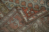 Distressed Kurd rug pile, even wear to knot heads, rust, slate geometric patterns, secured side.