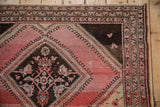 Corner spandrel with stylized bird motifs and narrow borders on a vintage Malayer rug.