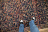 Fine-weave Herati motif on an antique Persian Malayer rug showing even wear to knot heads.