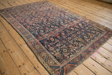 Angled perspective of an antique Malayer rug featuring its intricate Herati motif.