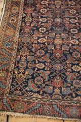 Exquisite fine weave and intricate Herati motif on an antique Persian Malayer rug.