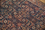 Fine weave and even wear of an antique Malayer rug's intricate Herati pattern.