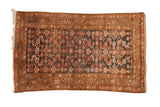 Decorative distressed Hamadan rug with Herati design in charcoal, ruby, and coffee brown.