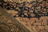 Antique Malayer carpet detail: navy field with splayed floral cross-sections and olive border.
