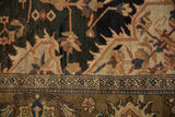 Close-up of antique Malayer carpet: navy field, polychrome floral vines, and intricate border.