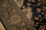 Antique Malayer carpet: curvilinear olive field with floral motifs, meeting navy field and geometric border.