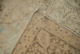 Soft wool pile and faint foundation visible on the antique distressed Kerman rug.