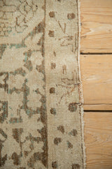Worn wool pile and selvage of antique Kerman carpet, with ivory, brown, and powder blue details.