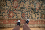A personal perspective on the antique Bijar's even wear and intricate Harshang design.