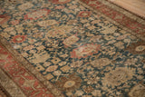 Angled view of the antique Bijar's Harshang design with visible knot heads.