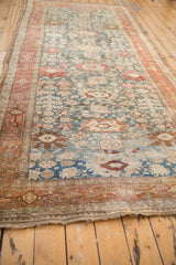 Perspective view of an antique Bijar runner highlighting the flow of its Harshang pattern.