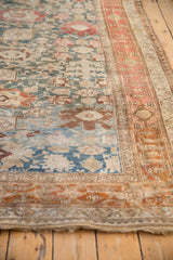 Angled view of the time-softened texture on an antique Bijar rug with Harshang design elements.