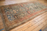 Full view of the antique distressed Bijar runner, showing its time-softened patina across the field.