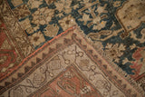 Antique Bijar rug corner showing the distressed pile and hand-knotted back foundation.