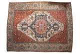 Antique Karaja carpet features an oversized stepped medallion on a copper-red field of blossoms.