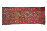 Antique Northwest Persian runner, abrashed red field, sprawling florals, blue and green paisley border.