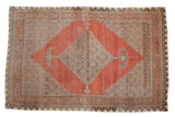 Antique Halvai Bijar carpet, bold burnt orange abrashed field, Herati medallion, softened tones.