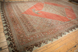 Antique Distressed Halvai Bijar carpet corner displaying Herati field, samovar turtle border, and soft patina.