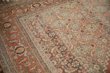 Distressed pile of antique Halvai Bijar rug, highlighting Herati motifs and samovar turtle border in muted tones.