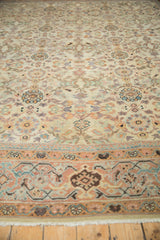 Antique Mahal carpet detail: blossom medallions, vine patterns, and a border in cream, pistachio, blue.