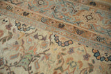Antique Mahal carpet detail showing cream field's stylized blossoms and border patterns.