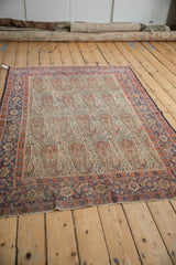 Antique Persian Senneh rug field, intricate ivory with oversize paisley botehs and Herati borders.