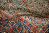 Antique Senneh rug with intricate Herati border and floral botehs in terra cotta and blue.