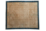 Antique Art Deco carpet with a tone-on-tone beige field and a wide cobalt blue geometric border.