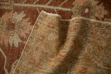 Detailed view of the hand-knotted foundation on a distressed vintage Heriz Persian carpet.