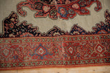 Antique Fereghan rug detail: tomato red border and ivory field with corner spandrel.