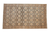 Vintage distressed Sivas carpet with an allover diamond medallion pattern in sand, slate blue, and charcoal.