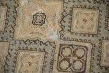 Detail of the worn, abrashed pile on a vintage Sivas carpet showing geometric panel medallions.