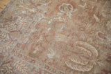 Detailed view of the distressed pile and willow leaf pattern on a Persian Sultanabad rug.