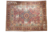Antique Kerman carpet, oversized medallion, thousand flower motif field in cochineal red and blue.