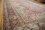 Antique Kerman carpet field with cochineal red, sky blue, and ivory thousand flower motifs.