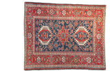 Antique Persian Karaja rug with a geometric triple medallion design in cherry red and cobalt blue.