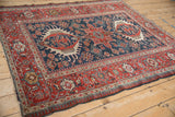 An antique Karaja rug displaying its triple medallion field and reciprocating pawn border.