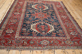 A fine antique Karaja rug's classic triple medallion pattern viewed from a high angle.