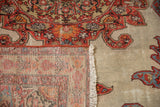 Hand-knotted construction visible on the back of a folded antique Malayer rug corner.