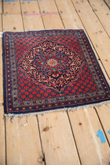 Vintage Persian Kashan mat showing its overall navy, red, and beige coloration.