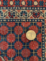 Close-up of the articulated knot heads and foundation on a vintage Persian Kashan rug.